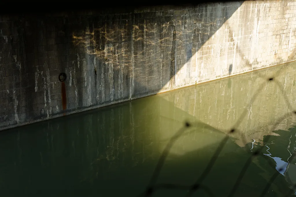 light reflections under a bridge